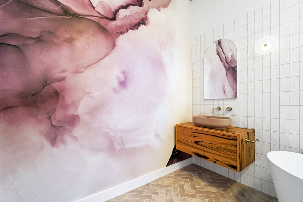 Mushroom Lauren Pill concrete basin by DLH Designs on a timber vanity in a bathroom with a striking light purple wallpaper graphic