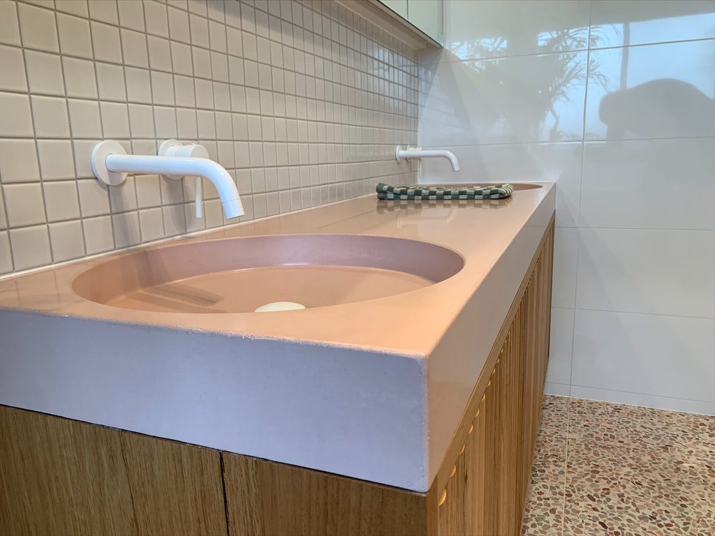 Custom concrete vanity top by DLH Designs in Blush pink on a timber vanity